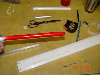 Aileron counter balance rods - checkered 001.jpg